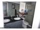Modern bathroom featuring double sinks, granite counters, updated vanity, and a glass shower at 444 Viewmont Dr, Henderson, NV 89015