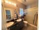 Well-lit bathroom features double vanity sinks, tile flooring and shower at 444 Viewmont Dr, Henderson, NV 89015