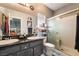 Bright bathroom featuring a double sink vanity and a glass door shower at 444 Viewmont Dr, Henderson, NV 89015