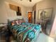 Comfortable bedroom with southwestern style comforter and horse art creating a relaxing retreat at 444 Viewmont Dr, Henderson, NV 89015