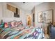 Bedroom featuring a bed with colorful pillows and a unique decor at 444 Viewmont Dr, Henderson, NV 89015