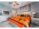 Comfortable bedroom with an orange blanket and a ceiling fan for a relaxing atmosphere at 444 Viewmont Dr, Henderson, NV 89015