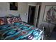 Stylishly decorated bedroom with unique bedding, modern lighting, and artistic accents at 444 Viewmont Dr, Henderson, NV 89015