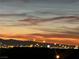 Panoramic city view at dusk with vibrant skyline and mountains in the background at 444 Viewmont Dr, Henderson, NV 89015