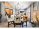 Dining room featuring stylish light fixture, decor, and seating for four near natural light at 444 Viewmont Dr, Henderson, NV 89015