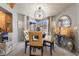 Stylish dining room with a modern chandelier and seating for four at 444 Viewmont Dr, Henderson, NV 89015