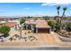 Well-maintained home with desert landscaping, palm trees, and a spacious driveway at 444 Viewmont Dr, Henderson, NV 89015