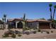 Inviting Southwest home featuring desert landscaping, a Spanish-tile roof, and an attached two-car garage at 444 Viewmont Dr, Henderson, NV 89015
