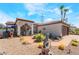 Charming single story home with desert landscaping, sidewalk, and beautiful wolf statue at 444 Viewmont Dr, Henderson, NV 89015
