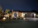 Beautiful single-story home illuminated at night, featuring desert landscaping at 444 Viewmont Dr, Henderson, NV 89015