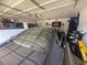 Well-equipped garage with car, motorcycle, tools, and Harley-Davidson banner at 444 Viewmont Dr, Henderson, NV 89015