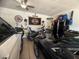Well-organized garage space with motorcycles, tool storage, and vehicle parking at 444 Viewmont Dr, Henderson, NV 89015