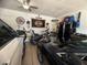 Organized garage space with Harley-Davidson decor, tools, and visible vehicles at 444 Viewmont Dr, Henderson, NV 89015