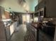 Cozy kitchen features gray cabinetry, stainless appliances and a convenient breakfast bar with seating at 444 Viewmont Dr, Henderson, NV 89015