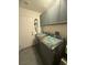 Functional laundry room with modern washer and dryer, storage cabinets, and tiled floor at 444 Viewmont Dr, Henderson, NV 89015