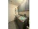 Functional laundry room with modern washer and dryer units and overhead cabinets at 444 Viewmont Dr, Henderson, NV 89015