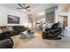 Spacious living room with modern decor, a large sectional sofa, and plenty of natural light at 444 Viewmont Dr, Henderson, NV 89015