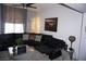 Comfortable living room area with a leather sectional sofa and decorative accents at 444 Viewmont Dr, Henderson, NV 89015