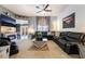 Modern living room with stylish gray walls, contemporary decor, and a comfortable sectional sofa at 444 Viewmont Dr, Henderson, NV 89015