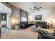 Living room with stylish gray walls, contemporary decor, and a comfortable sectional sofa at 444 Viewmont Dr, Henderson, NV 89015