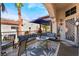 Inviting patio area with comfortable seating and an umbrella, perfect for relaxing outdoors at 444 Viewmont Dr, Henderson, NV 89015