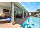 Beautiful backyard pool with comfortable seating and outdoor lounging areas at 444 Viewmont Dr, Henderson, NV 89015