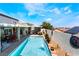 Tranquil outdoor oasis with a pool, covered patio, and desert-friendly landscaping at 444 Viewmont Dr, Henderson, NV 89015