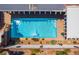 Aerial view of a private in-ground pool with desert landscaping and sunning area at 444 Viewmont Dr, Henderson, NV 89015