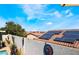 Energy-efficient home featuring solar panels on the roof and a beautiful yard at 444 Viewmont Dr, Henderson, NV 89015