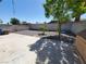Backyard with a concrete patio, gravel landscaping, block wall, and trees at 4509 Bingham Ave, Las Vegas, NV 89110