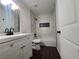 Modern bathroom with white vanity, updated fixtures, and tiled shower/tub combo at 4509 Bingham Ave, Las Vegas, NV 89110