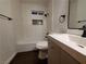 Modern bathroom featuring a tub with tiled walls and sleek fixtures at 4509 Bingham Ave, Las Vegas, NV 89110