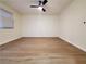 Spacious bedroom featuring wood-look flooring, a ceiling fan, and natural light at 4509 Bingham Ave, Las Vegas, NV 89110