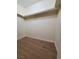 Walk-in closet with wood-look flooring and a simple rack for clothing storage at 4509 Bingham Ave, Las Vegas, NV 89110
