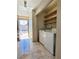 Laundry area featuring a washer, dryer, and shelving at 4509 Bingham Ave, Las Vegas, NV 89110