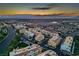 Picturesque aerial view of the community, capturing the colorful buildings against a desert sunset backdrop at 51 Morning Mimosa Ct, Henderson, NV 89012