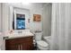 Well-lit bathroom features a single-sink vanity and a bathtub with shower at 51 Morning Mimosa Ct, Henderson, NV 89012