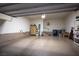 Spacious garage with an epoxy floor, and ample storage, providing functionality at 51 Morning Mimosa Ct, Henderson, NV 89012