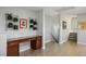 Bright hallway features desk area with drawers, modern decor, and stairs leading to upper level at 51 Morning Mimosa Ct, Henderson, NV 89012