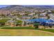 Aerial view of a park featuring a colorful playground, shaded seating, and walking paths amid greenery at 51 Morning Mimosa Ct, Henderson, NV 89012