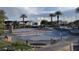 Community splash pad with various water features, surrounded by benches and lush landscaping at 51 Morning Mimosa Ct, Henderson, NV 89012