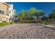 Outdoor sand volleyball court for friendly matches, surrounded by landscaped grounds and benches at 51 Morning Mimosa Ct, Henderson, NV 89012