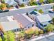 Aerial view of the backyard, mature trees, neighboring homes, and a block fence at 5112 Foggia Ave, Las Vegas, NV 89130