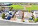Aerial view of the home showing the backyard, mature trees, and a block fence at 5112 Foggia Ave, Las Vegas, NV 89130