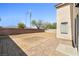 Backyard featuring a brick patio and gravel, providing a low-maintenance outdoor space at 5112 Foggia Ave, Las Vegas, NV 89130