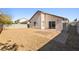Backyard features low maintenance gravel, block wall, and brick paver patio at 5112 Foggia Ave, Las Vegas, NV 89130