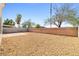 Backyard featuring a low-maintenance landscape and block fencing for privacy at 5112 Foggia Ave, Las Vegas, NV 89130