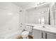 Bright bathroom featuring a bathtub and shower combination with a large vanity and mirror at 5112 Foggia Ave, Las Vegas, NV 89130