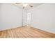 Clean bedroom with wood flooring, ceiling fan, and bright window at 5112 Foggia Ave, Las Vegas, NV 89130