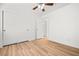 Bright bedroom featuring wood-look flooring, ceiling fan, and closet at 5112 Foggia Ave, Las Vegas, NV 89130